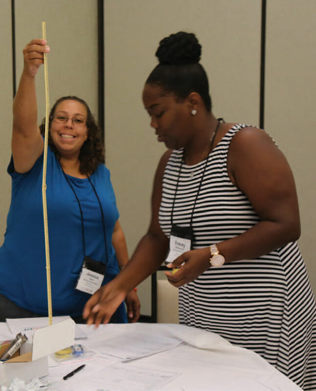 2 workshop members participating in activities.